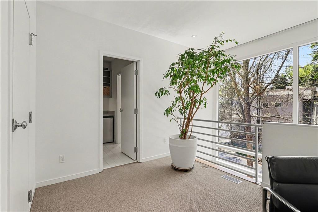 2465 Field Way Atlanta, GA 30319 - Photo 20 of 40 a potted plant sitting in front of a house