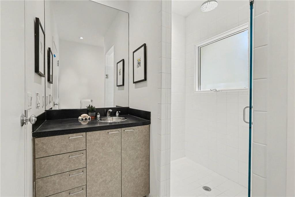 2465 Field Way Atlanta, GA 30319 - Photo 22 of 40 a bathroom with a sink and a mirror