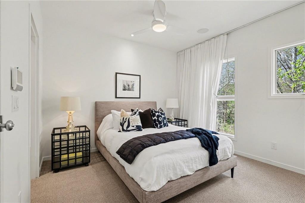2465 Field Way Atlanta, GA 30319 - Photo 24 of 40 a bedroom with a bed lamp and a window