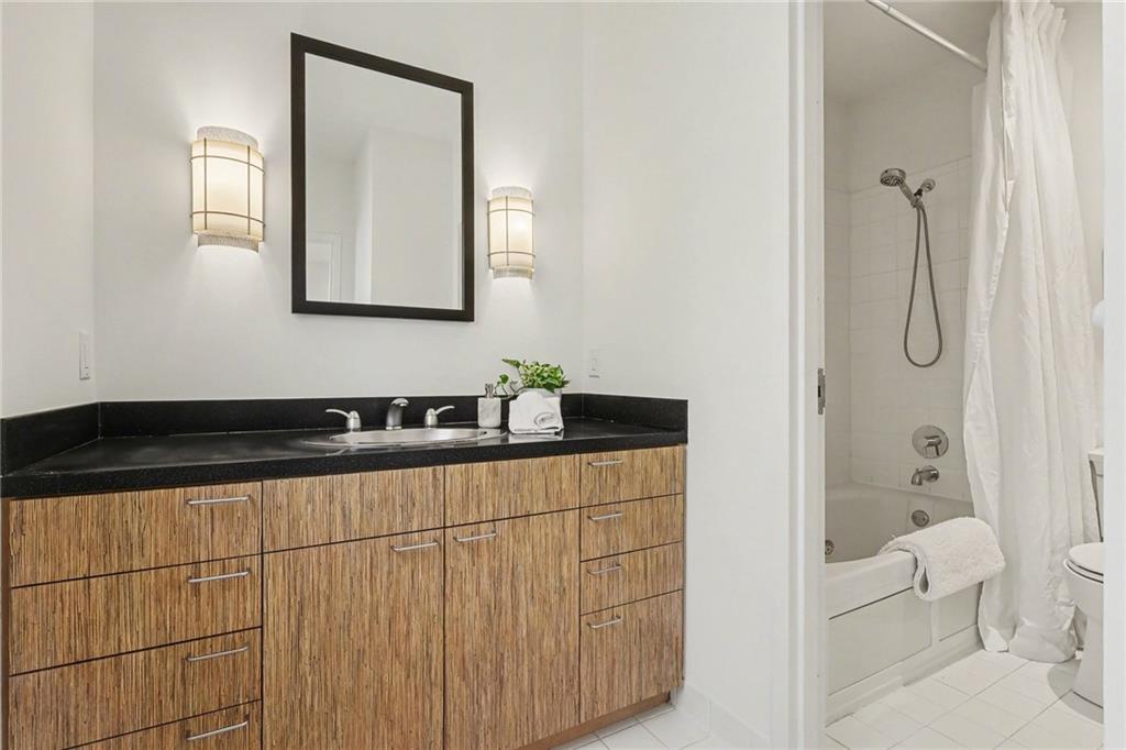 2465 Field Way Atlanta, GA 30319 - Photo 27 of 40 a bathroom with a sink a toilet and shower