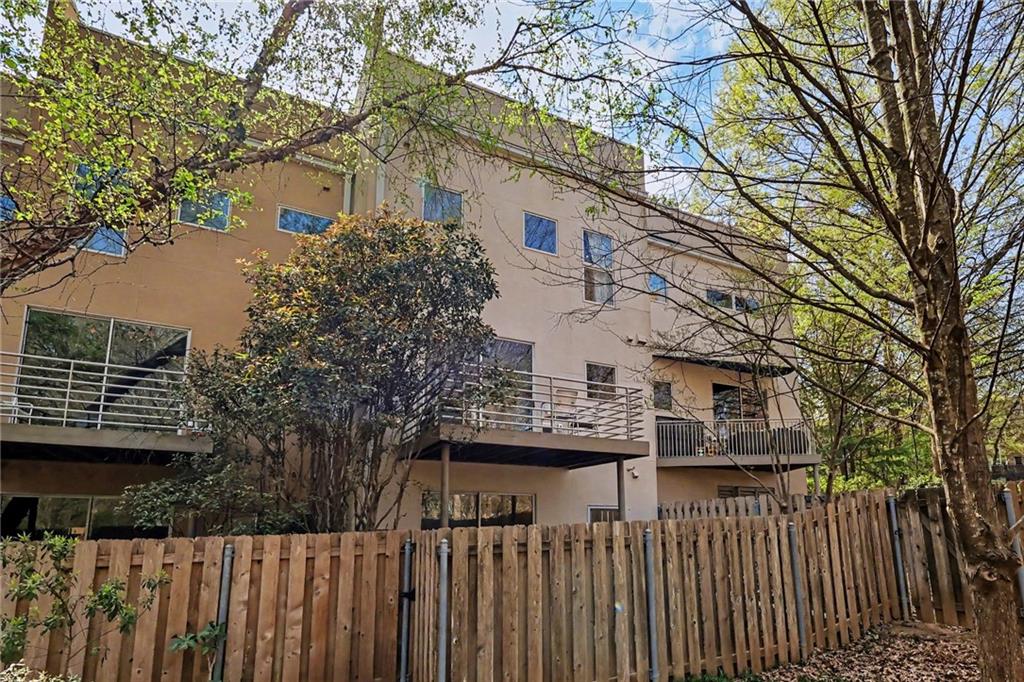 2465 Field Way Atlanta, GA 30319 - Photo 35 of 40 a view of a house with a small yard and wooden fence
