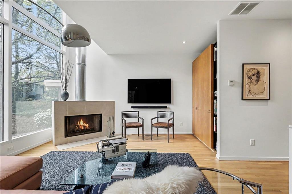 2465 Field Way Atlanta, GA 30319 - Photo 6 of 40 a living room with furniture a flat screen tv and a fireplace