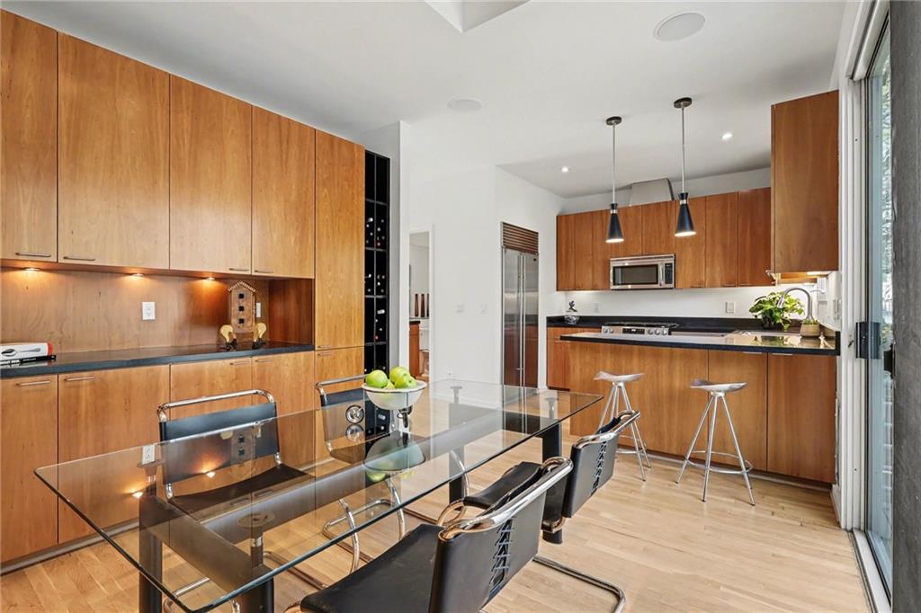 2465 Field Way Atlanta, GA 30319 - Photo 10 of 40 a living room with stainless steel appliances kitchen island granite countertop furniture and a refrigerator