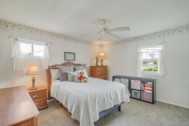 a bed room with a bed and a lamp