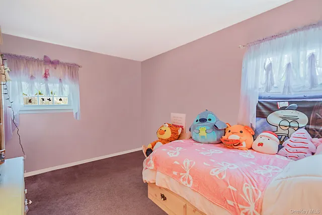 a bedroom with a bed and chandelier