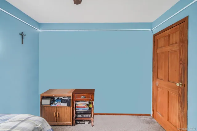 a room with a dresser and a window