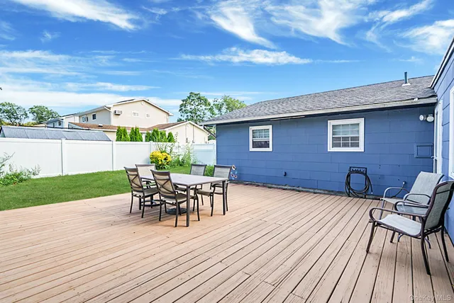 a view of a house with patio and wooden floor