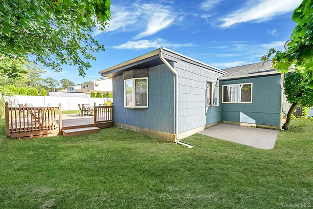 a view of a house with a yard and a garden