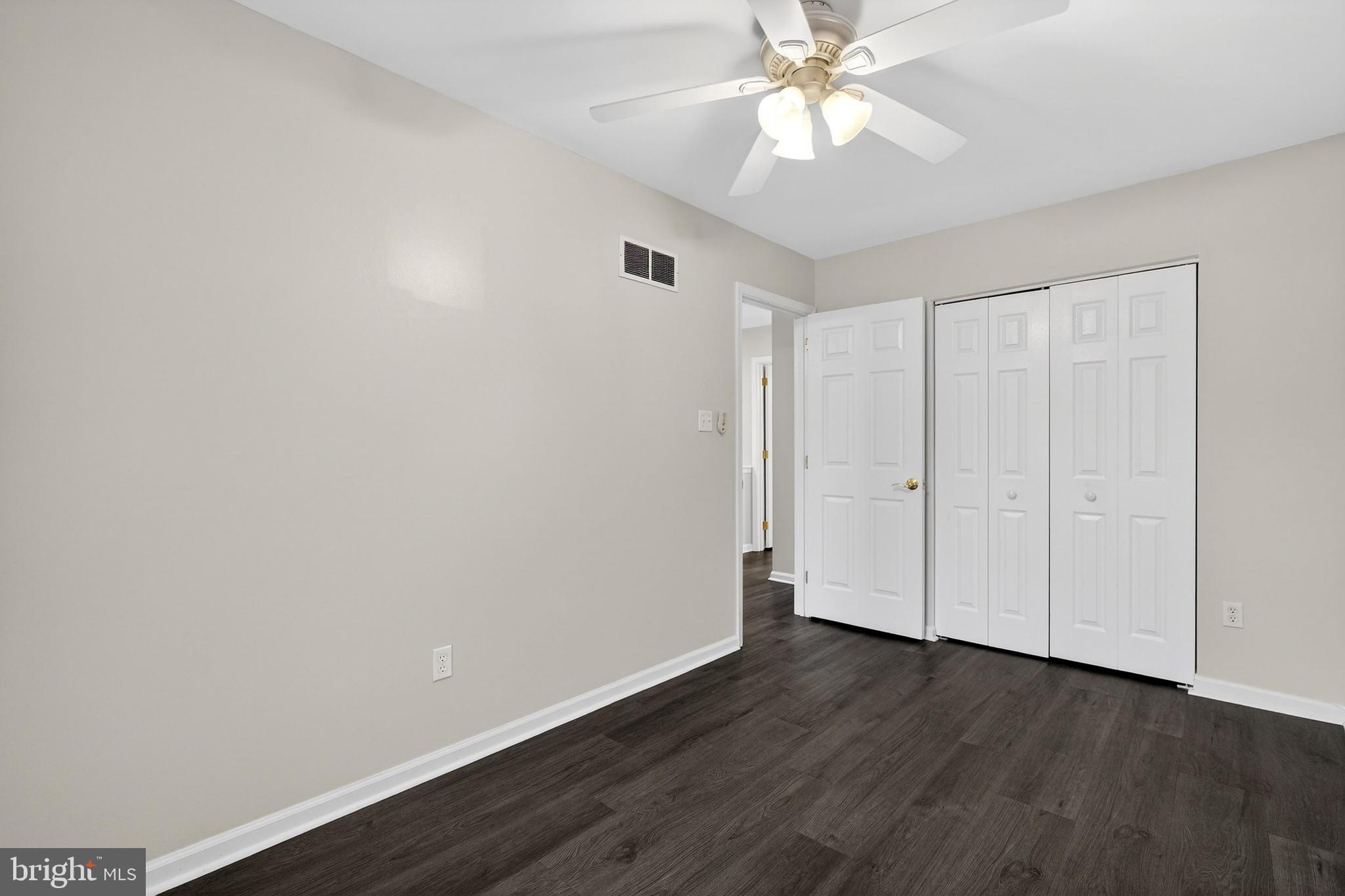 613 Candlestick Lane Newark, DE 19702 - Photo 17 of 33 a view of an empty room with wooden floor