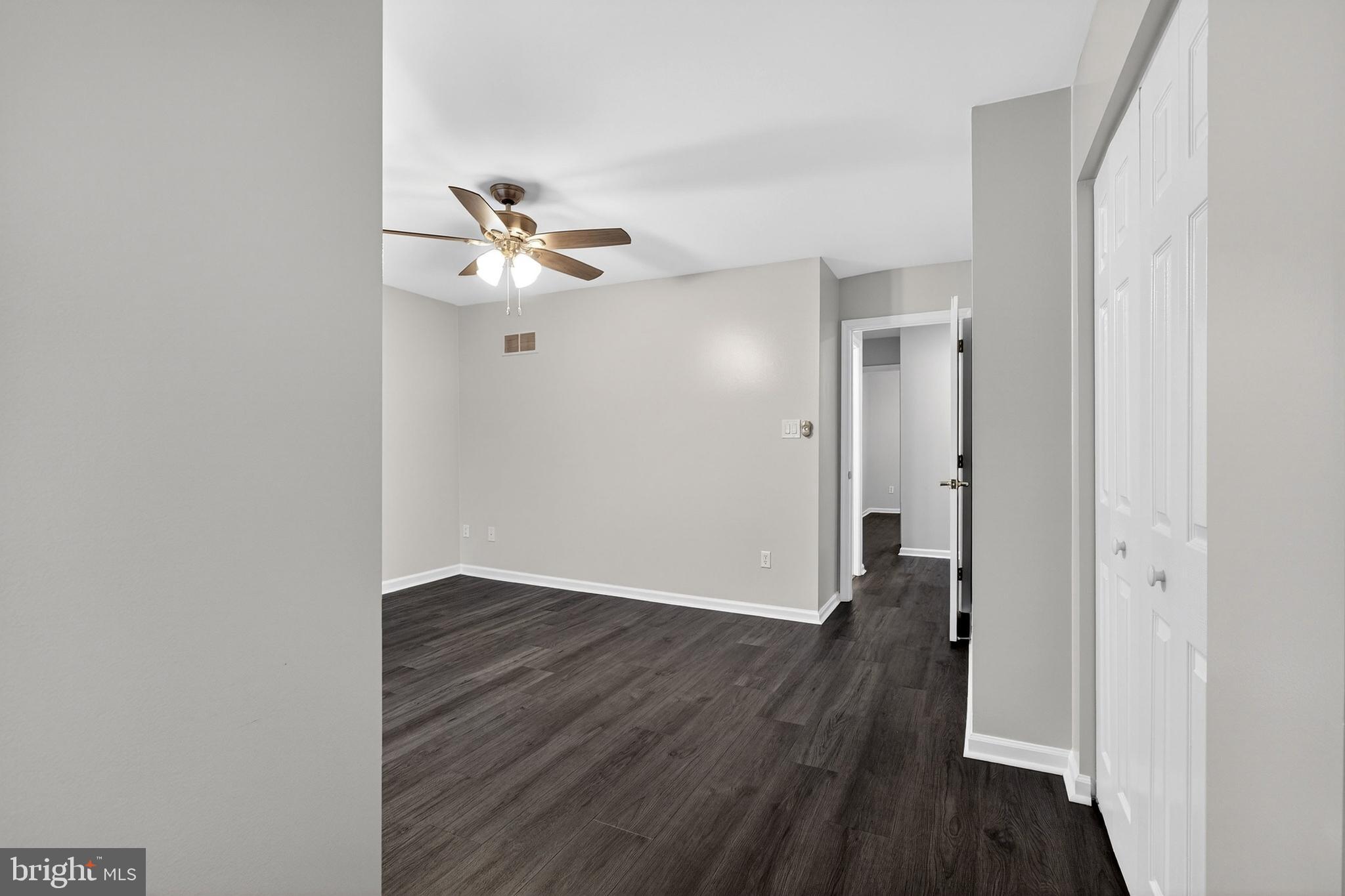 613 Candlestick Lane Newark, DE 19702 - Photo 20 of 33 a view of an empty room with wooden floor