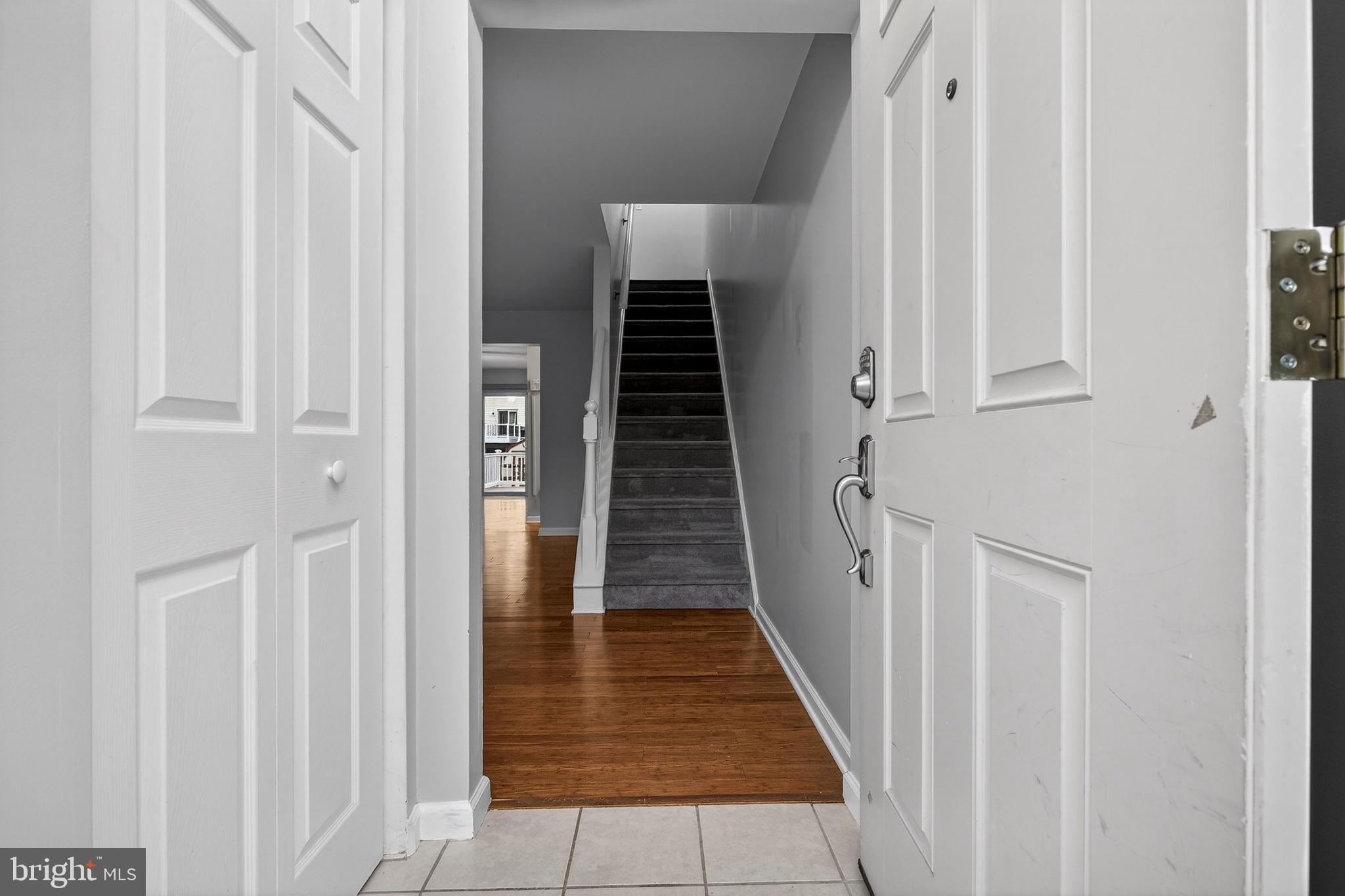 613 Candlestick Lane Newark, DE 19702 - Photo 3 of 33 a view of a hallway with wooden floor and entryway