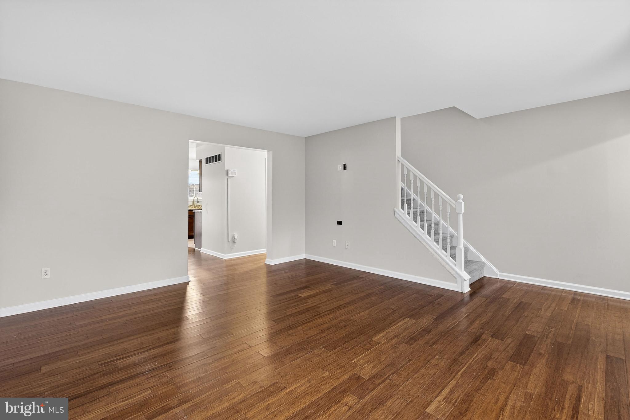 613 Candlestick Lane Newark, DE 19702 - Photo 5 of 33 a view of an empty room with wooden floor