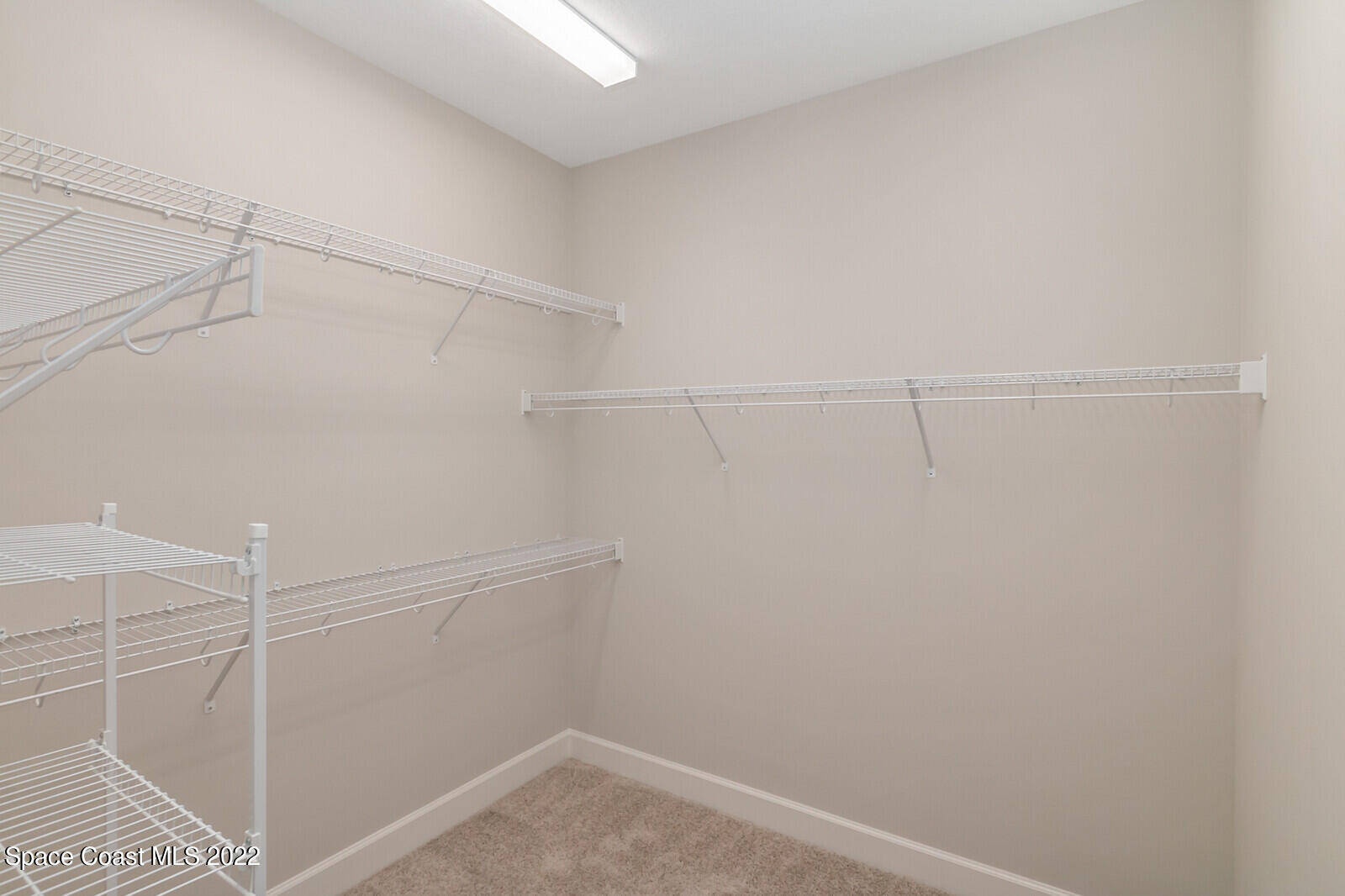 3289 Ribbon Grass Drive Melbourne, FL 32940 - Photo 11 of 58 a view of a room with racks on the wall