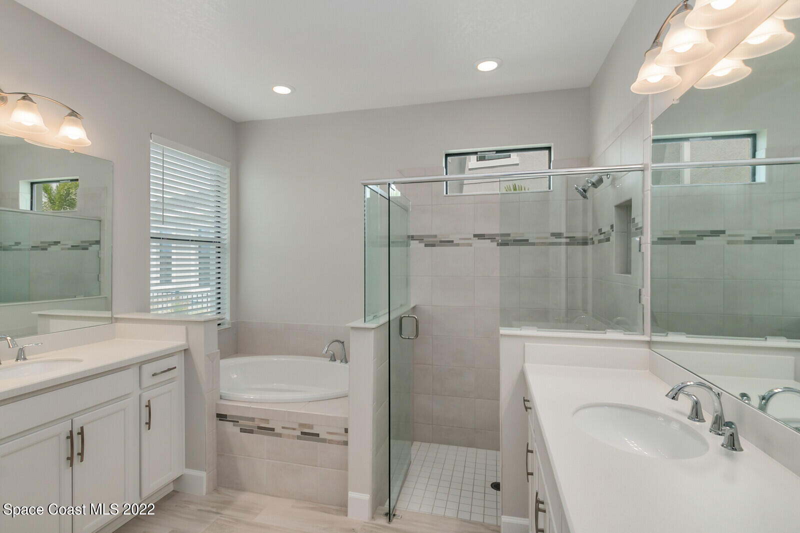 3289 Ribbon Grass Drive Melbourne, FL 32940 - Photo 12 of 58 a bathroom with a sink toilet and shower