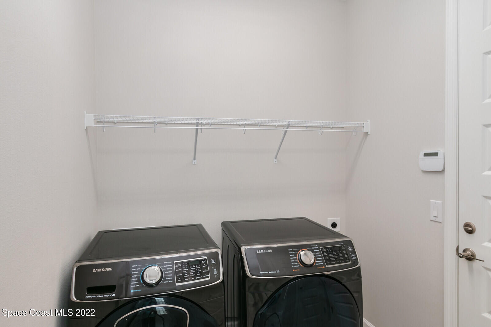 3289 Ribbon Grass Drive Melbourne, FL 32940 - Photo 16 of 58 a view of storage and utility room with washer and dryer