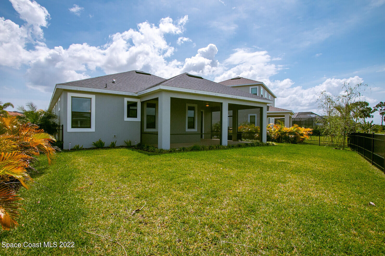 3289 Ribbon Grass Drive Melbourne, FL 32940 - Photo 19 of 58 a view of a house with a garden