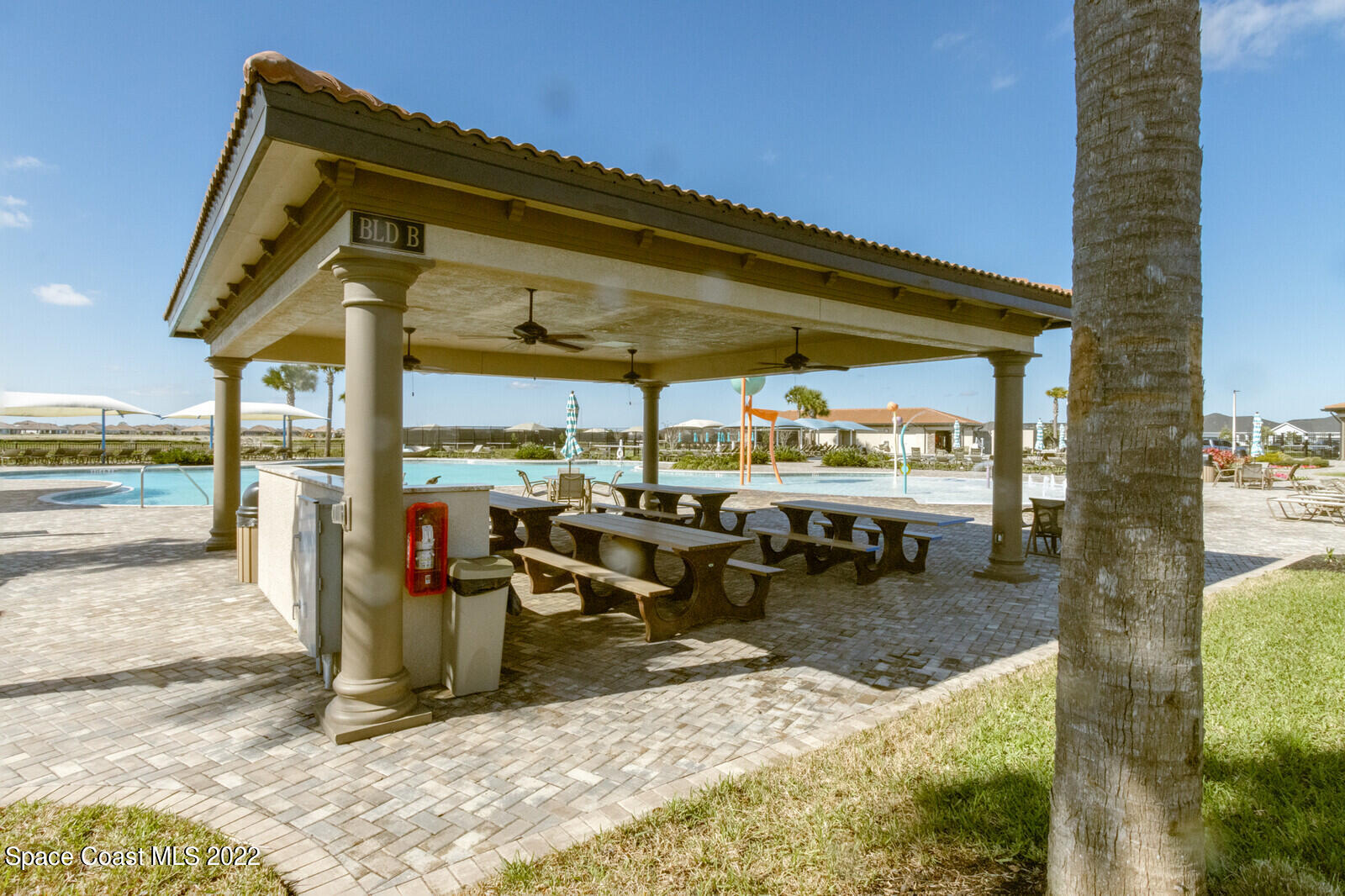 3289 Ribbon Grass Drive Melbourne, FL 32940 - Photo 30 of 58 a view of a patio with a table chairs and a patio