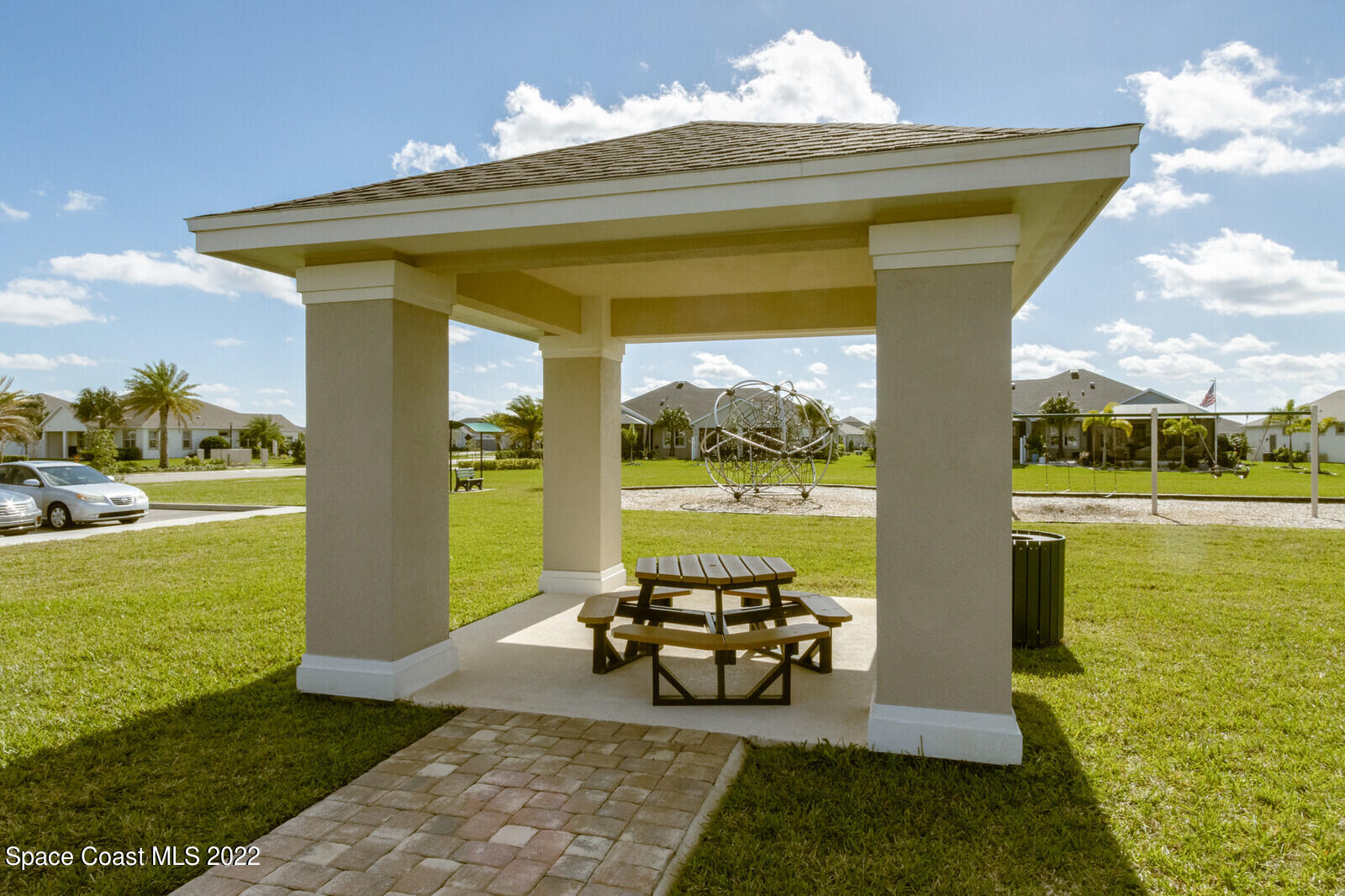 3289 Ribbon Grass Drive Melbourne, FL 32940 - Photo 35 of 58 a view of a porch with furniture and floor to ceiling window