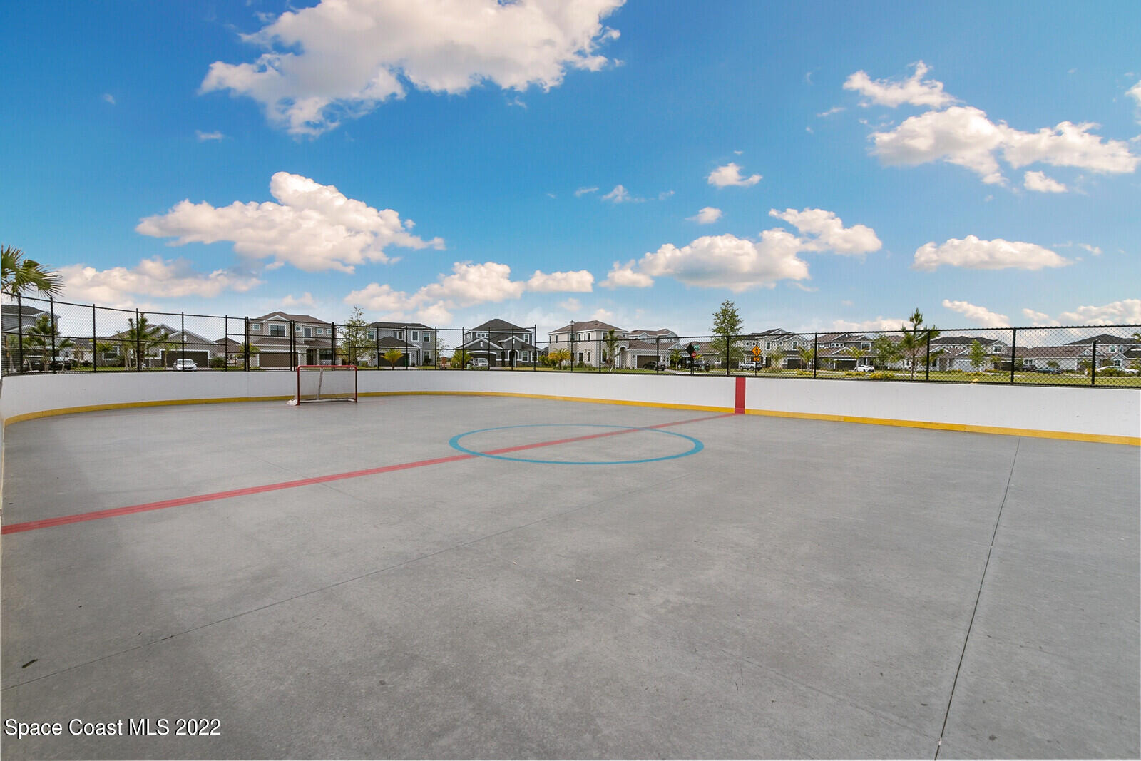 3289 Ribbon Grass Drive Melbourne, FL 32940 - Photo 42 of 58 a view of a basket ball ground and a building in the background