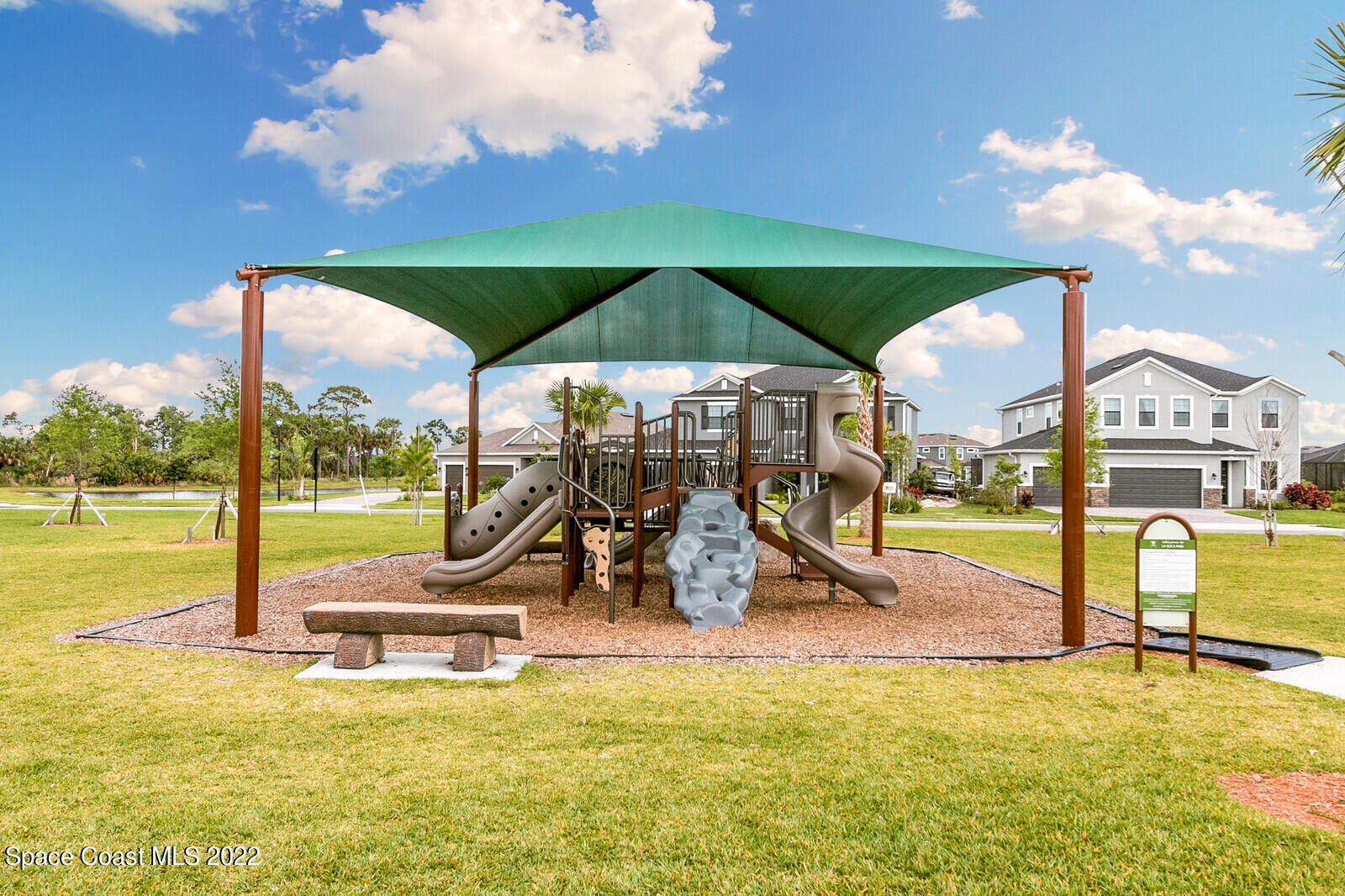 3289 Ribbon Grass Drive Melbourne, FL 32940 - Photo 44 of 58 a view of a swimming pool with lawn chairs