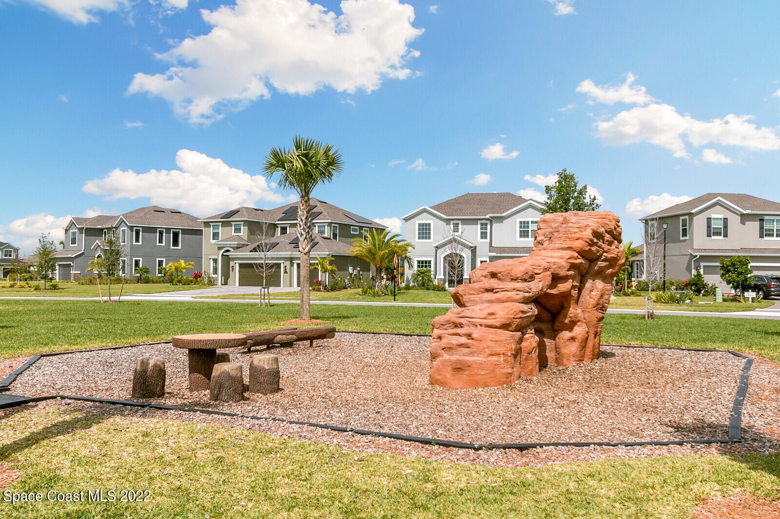 3289 Ribbon Grass Drive Melbourne, FL 32940 - Photo 47 of 58 a swimming pool with barbeque oven outdoor seating and yard
