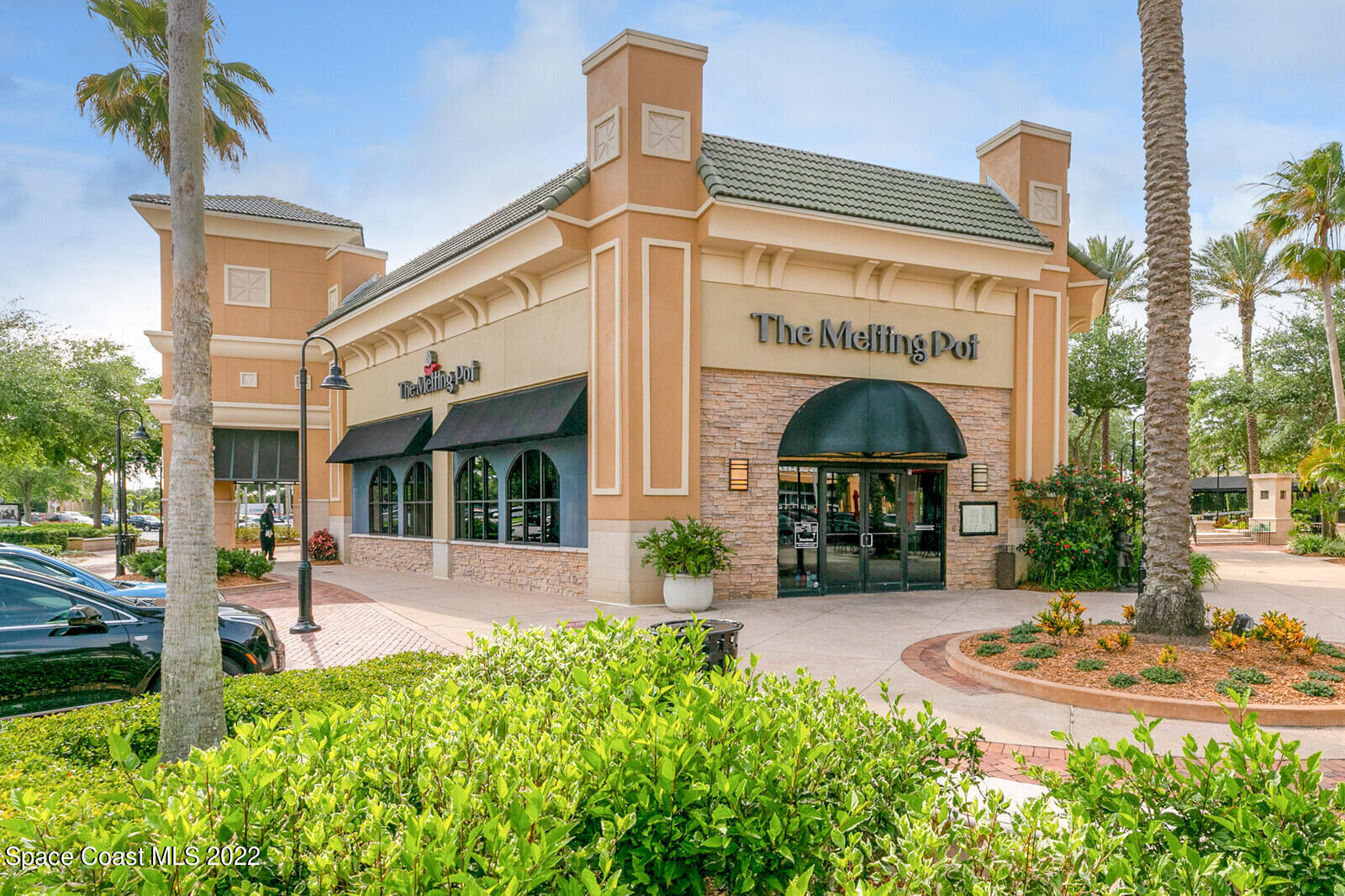3289 Ribbon Grass Drive Melbourne, FL 32940 - Photo 50 of 58 a view of a building with potted plants