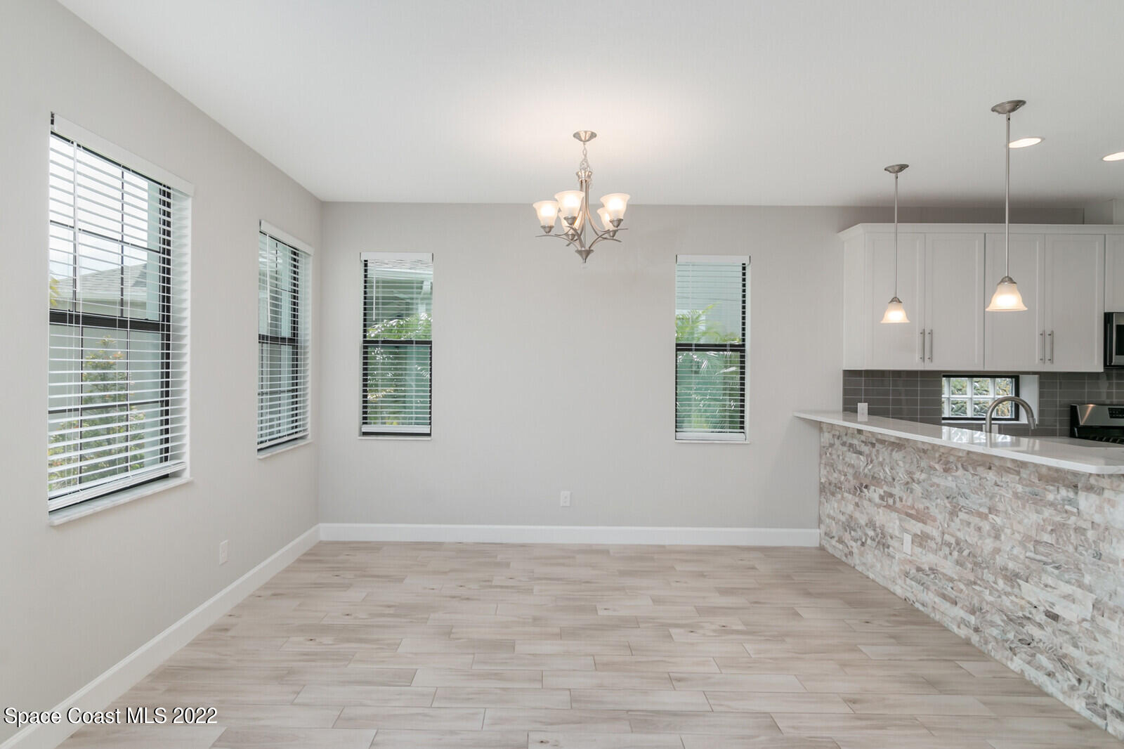 3289 Ribbon Grass Drive Melbourne, FL 32940 - Photo 5 of 58 a view of a kitchen with marble kitchen and a window