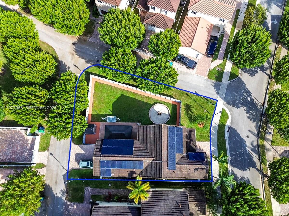 14027 Southwest 274th Terrace Homestead, FL 33032 - Photo 14 of 65 an aerial view of a house with yard swimming pool and outdoor seating