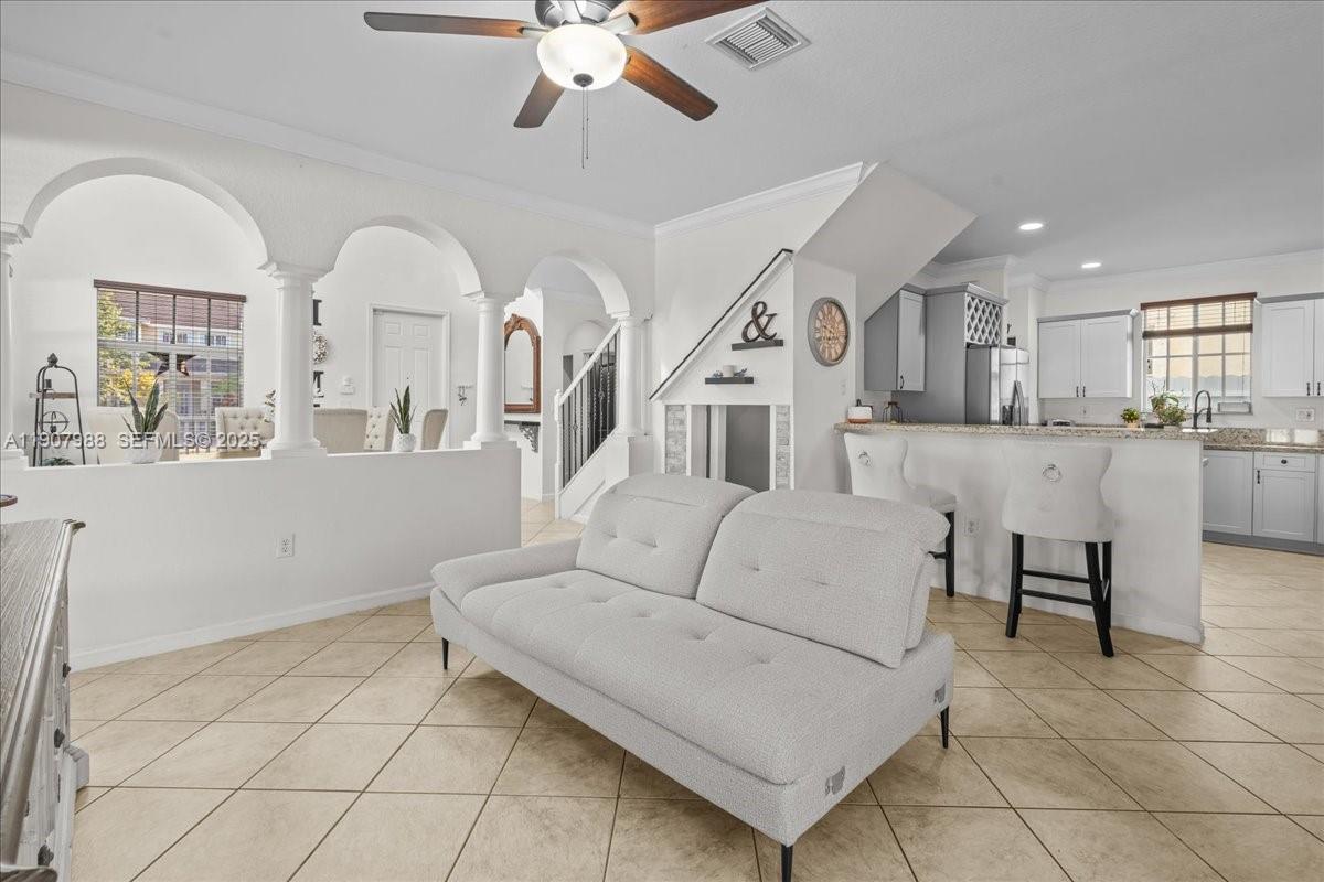 14027 Southwest 274th Terrace Homestead, FL 33032 - Photo 21 of 65 a living room with furniture and kitchen view