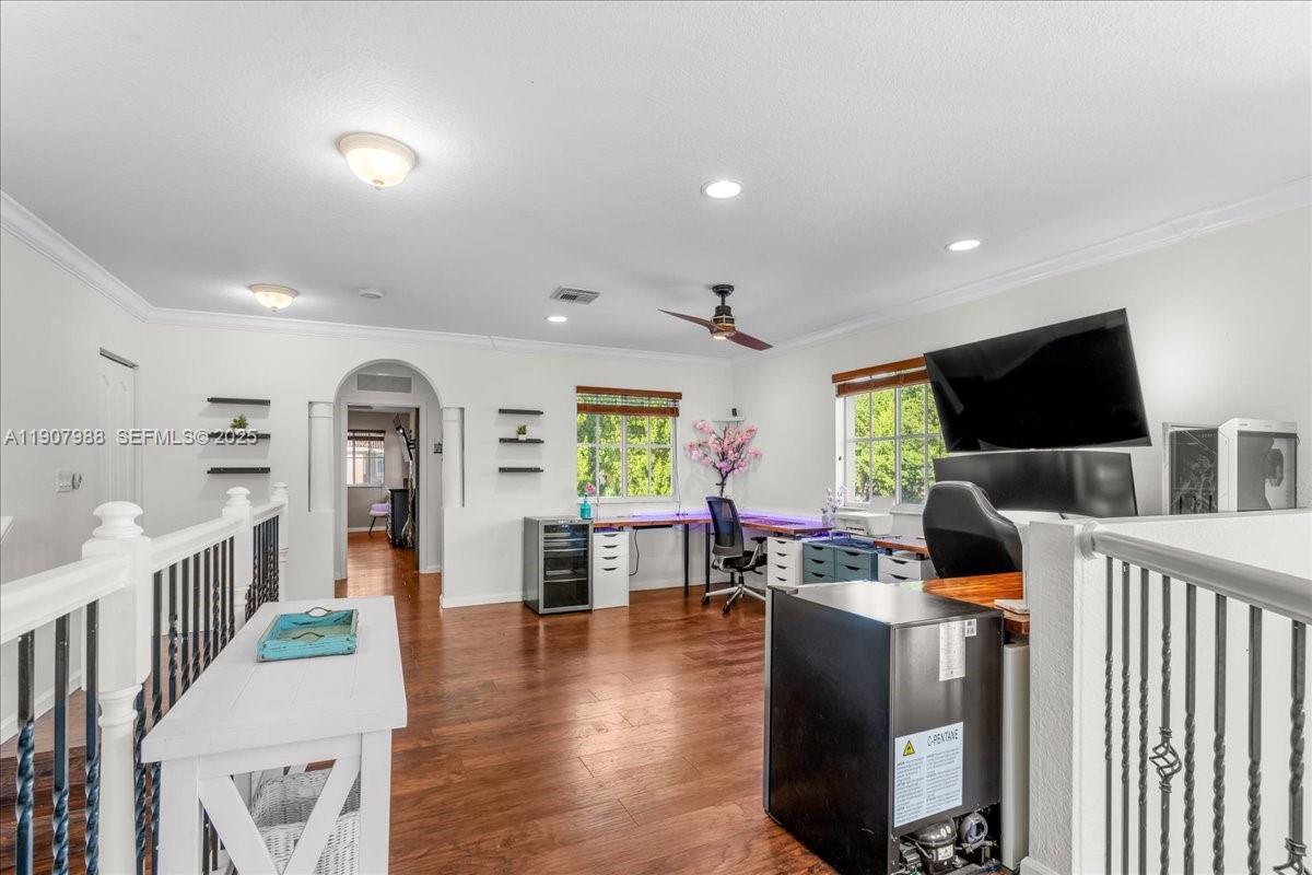 14027 Southwest 274th Terrace Homestead, FL 33032 - Photo 35 of 65 a living room with furniture and a flat screen tv