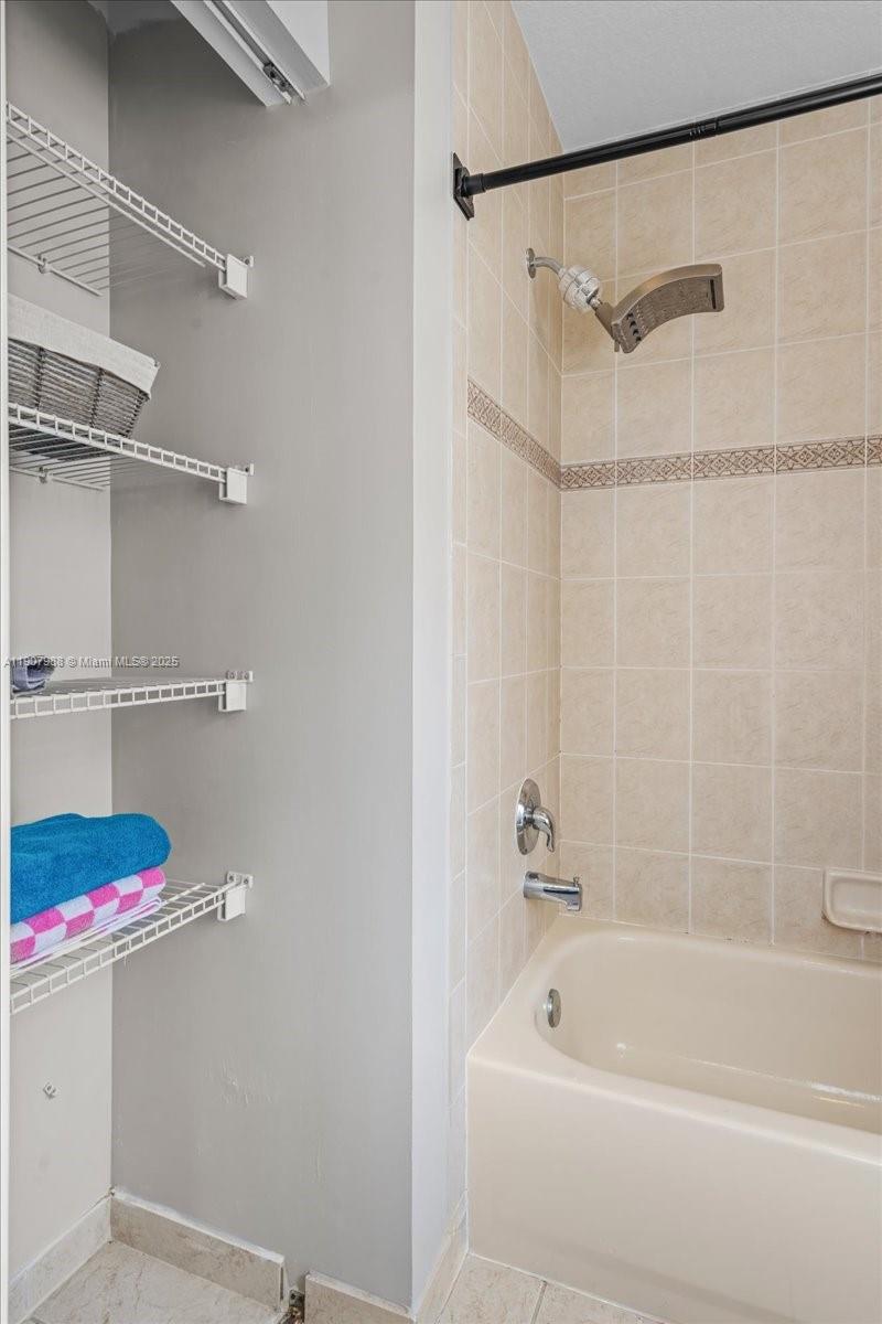 14027 Southwest 274th Terrace Homestead, FL 33032 - Photo 39 of 65 a bathroom with a bath tub and shower