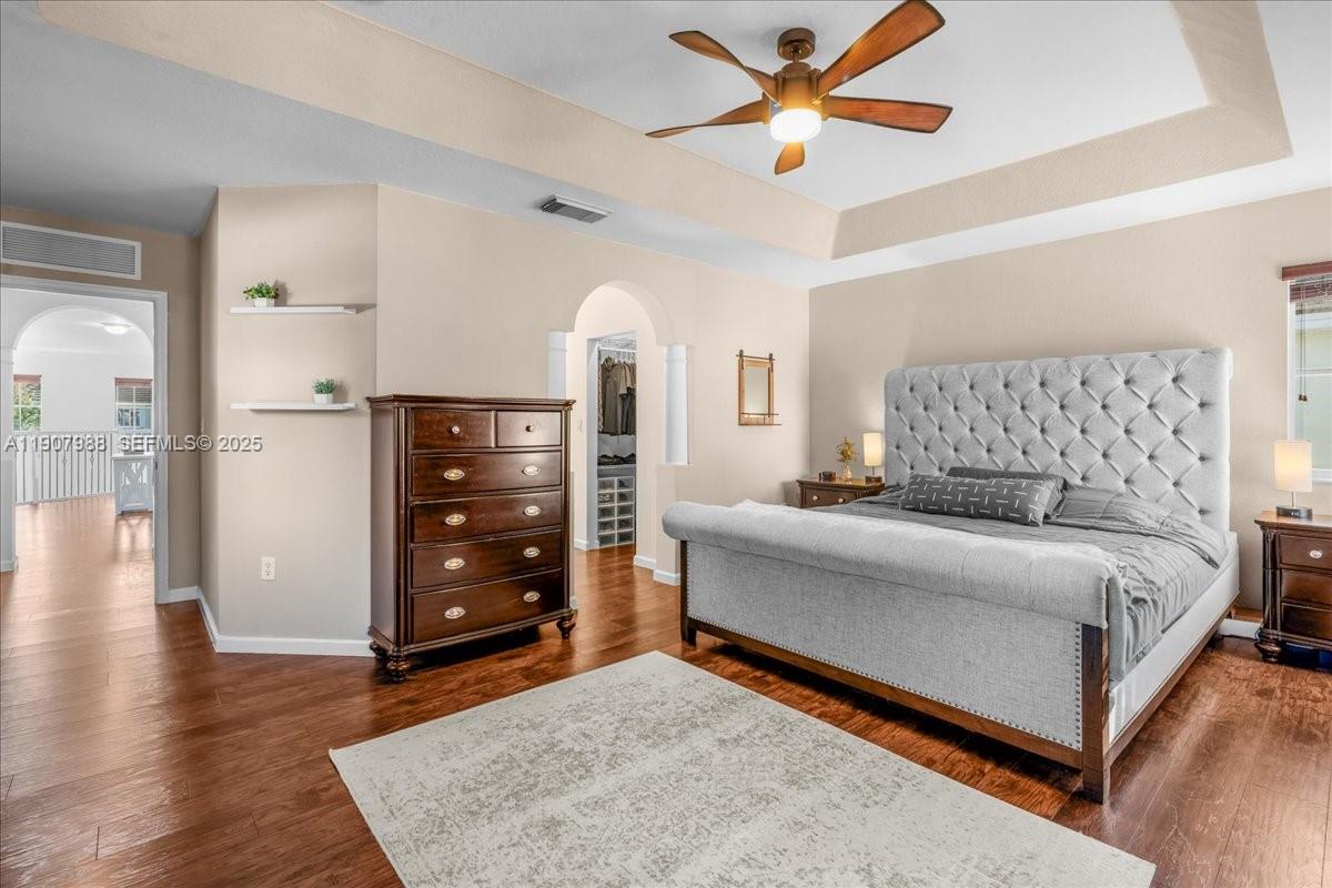 14027 Southwest 274th Terrace Homestead, FL 33032 - Photo 44 of 65 a bedroom with a bed and a dresser