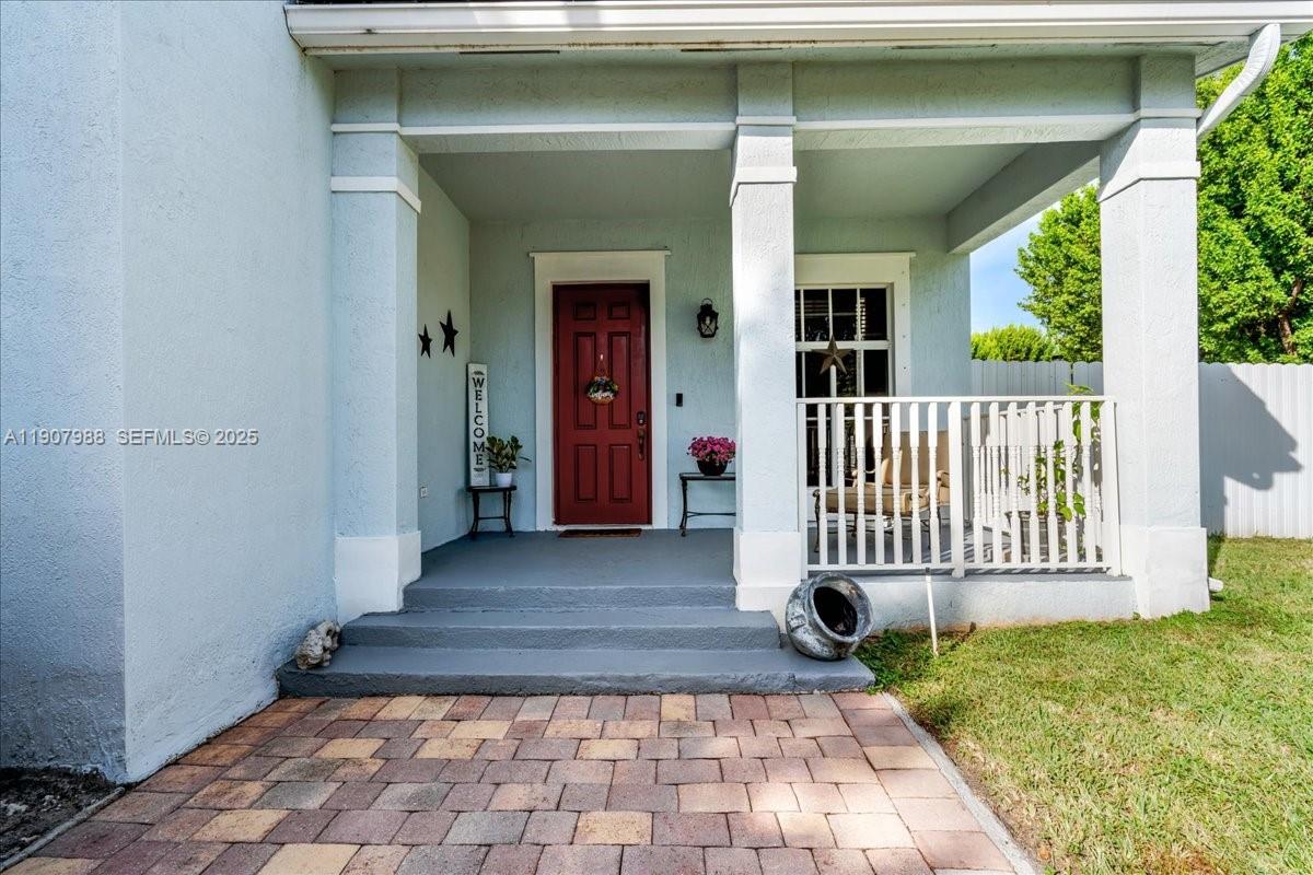 14027 Southwest 274th Terrace Homestead, FL 33032 - Photo 57 of 65 a view of a house with a yard