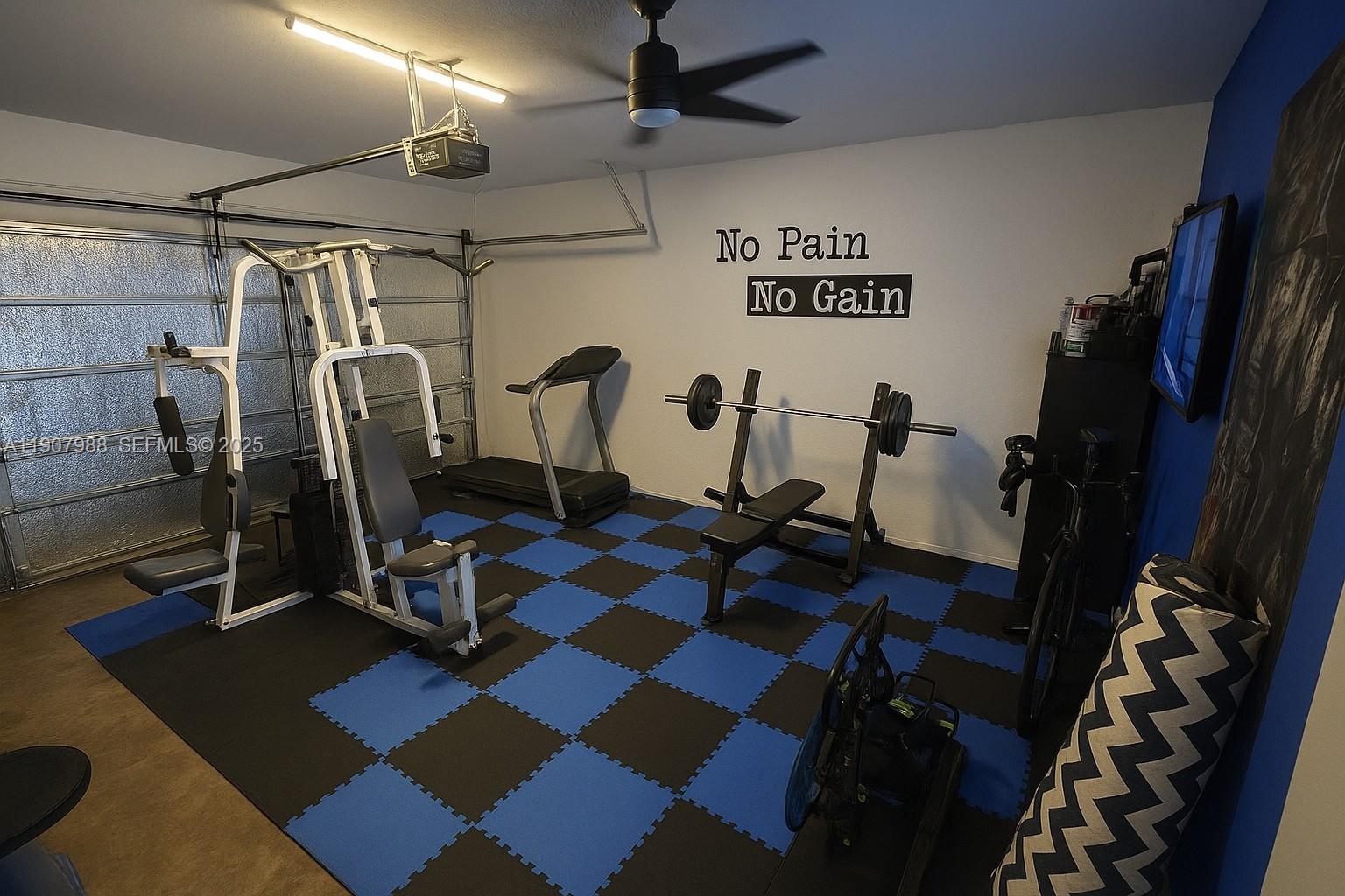 14027 Southwest 274th Terrace Homestead, FL 33032 - Photo 63 of 65 a view of a room with gym equipment