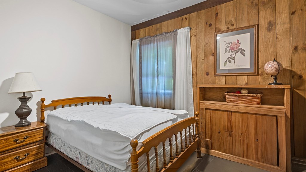 610 Madola Road Epworth, GA 30541 - Photo 12 of 16 a bedroom with a bed and a dresser