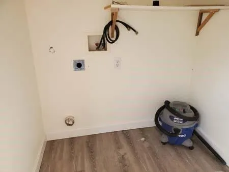 a bathroom with a shower and a sink