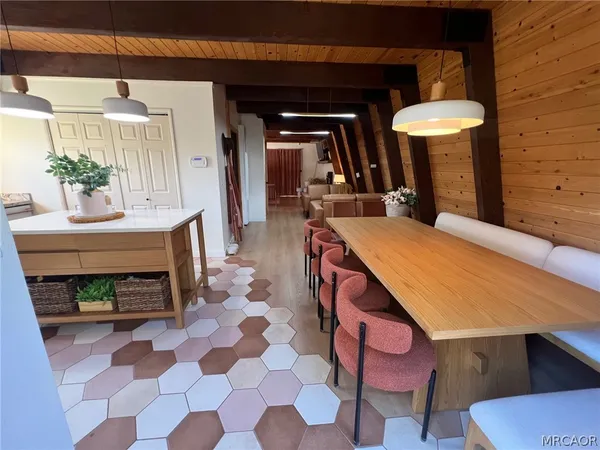 a dining room with a table and a fireplace