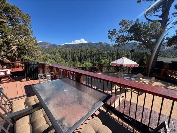 a view of a balcony with furniture