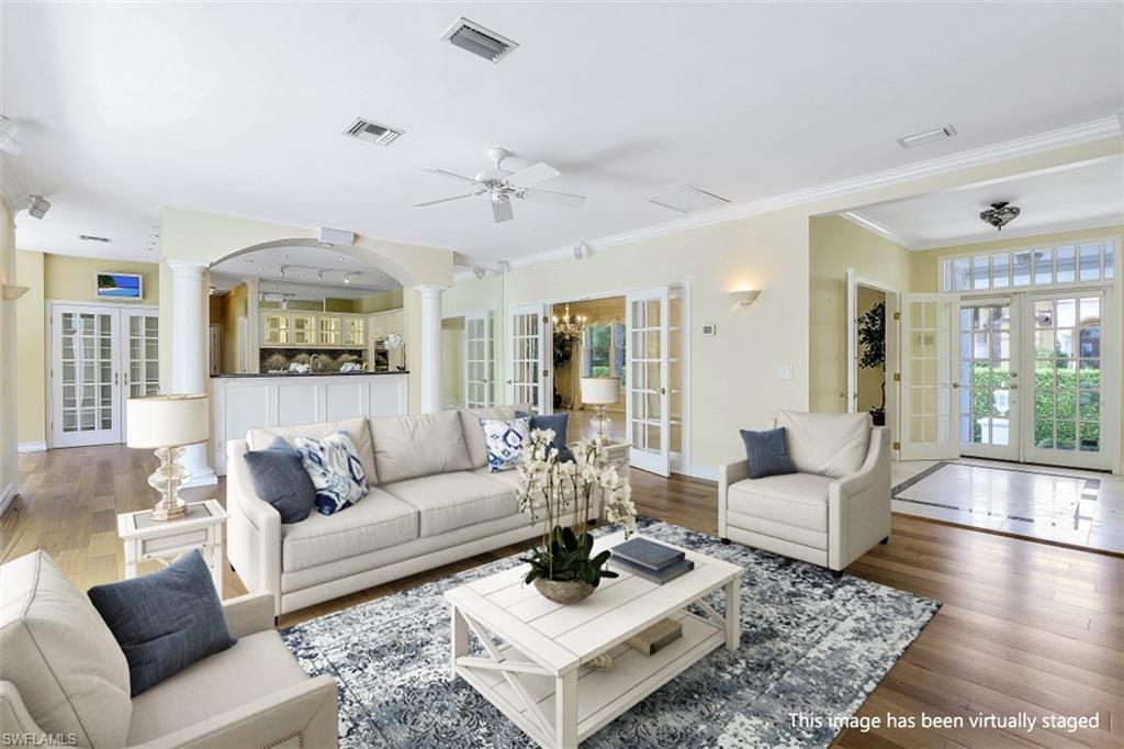 3277 Gordon Drive Naples, FL 34102 - Photo 1 of 33 a living room with furniture and a large window