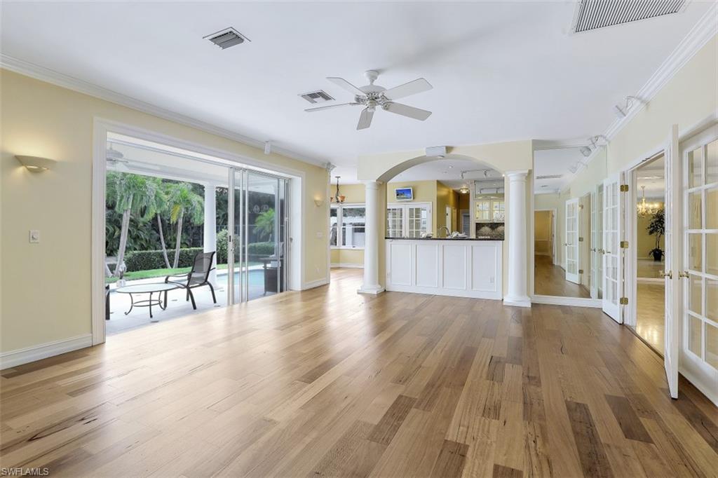 3277 Gordon Drive Naples, FL 34102 - Photo 12 of 33 a view of an entryway with wooden floor