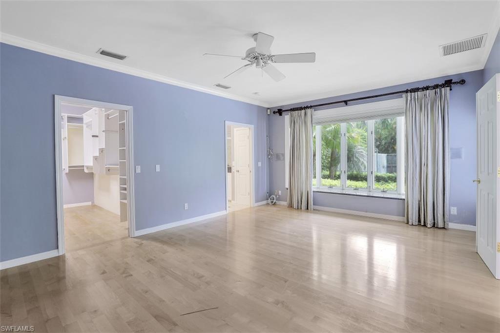 3277 Gordon Drive Naples, FL 34102 - Photo 18 of 33 a view of a livingroom with a ceiling fan and window