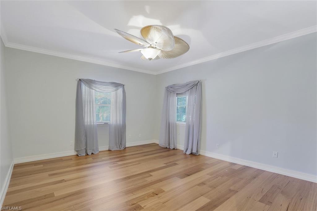 3277 Gordon Drive Naples, FL 34102 - Photo 23 of 33 a view of empty room with wooden floor
