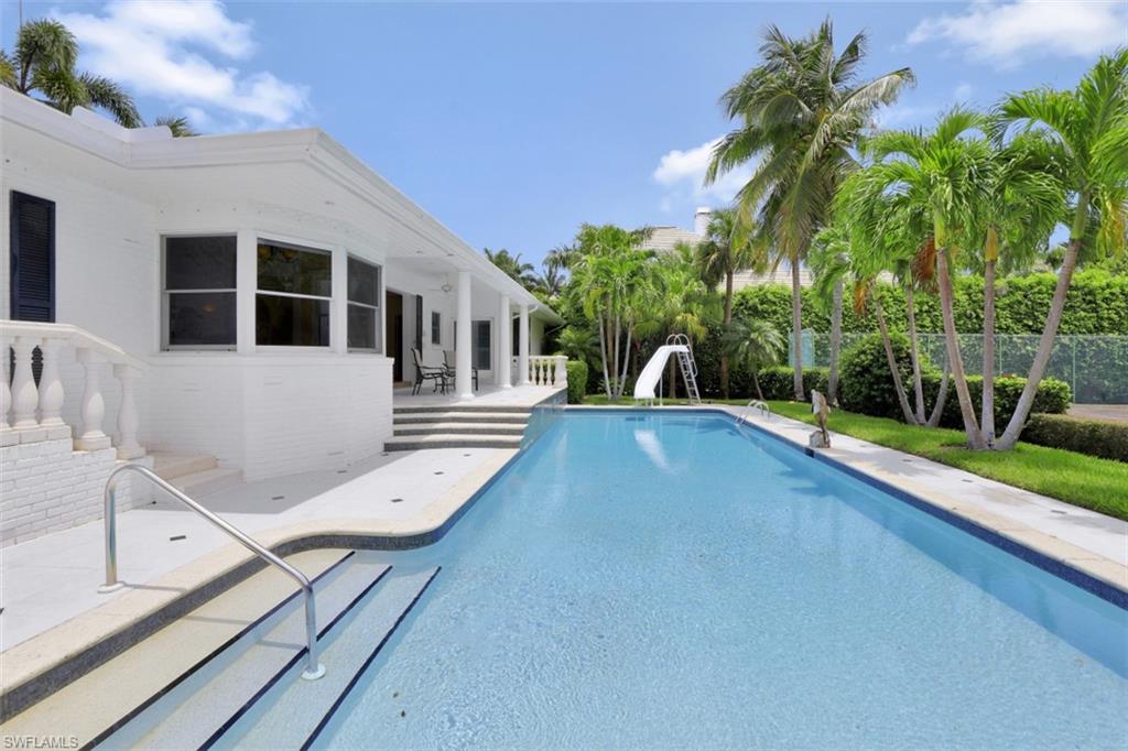 3277 Gordon Drive Naples, FL 34102 - Photo 25 of 33 a view of a house with a swimming pool