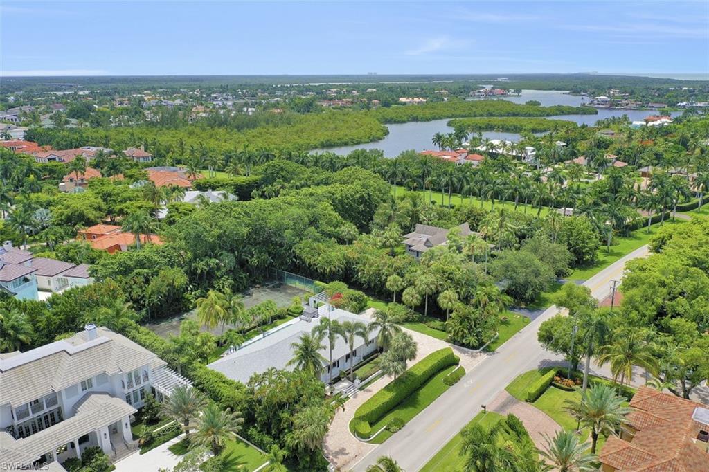 3277 Gordon Drive Naples, FL 34102 - Photo 31 of 33 an aerial view of green landscape with trees houses and mountain view