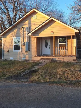 a front view of a house with yard
