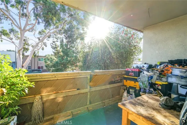 a view of a chairs and table in a balcony