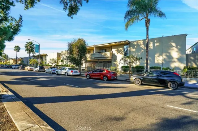 a view of street with parked cars