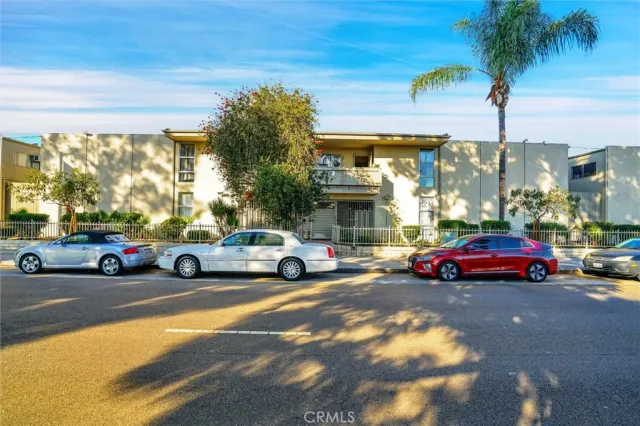 a view of cars parked in front of a building