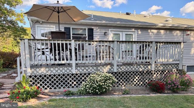 3460 Indian Run Road Amissville, VA 20106 - Photo 50 of 57 Charming deck with vibrant garden blooms.