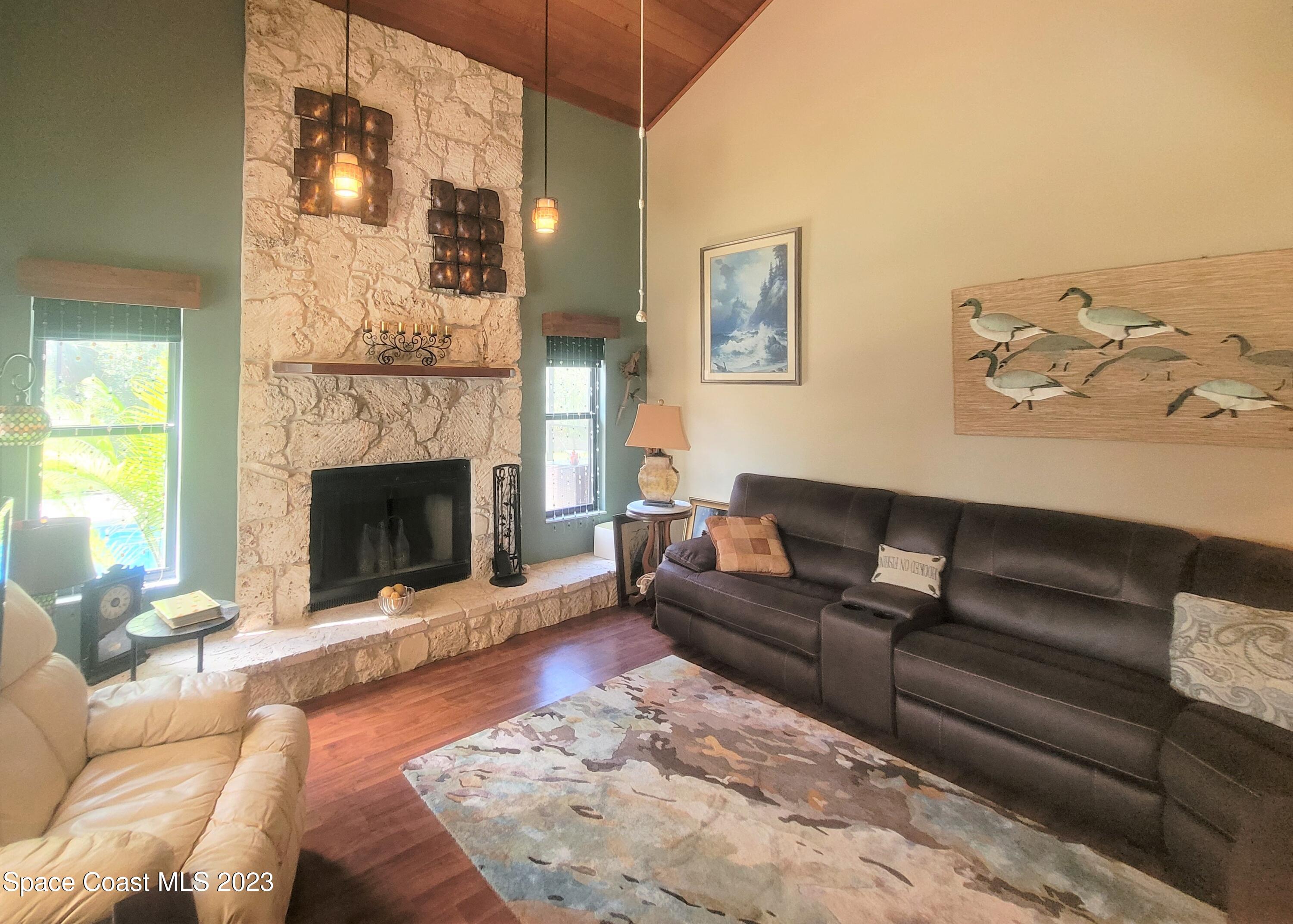 3805 Corey Road Malabar, FL 32950 - Photo 4 of 72 a living room with furniture and a fireplace